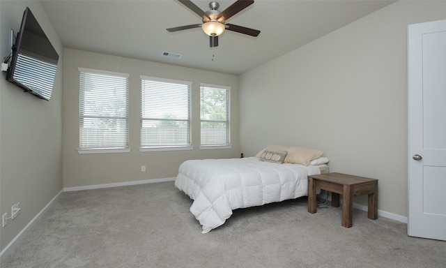 carpeted bedroom featuring vaulted ceiling and ceiling fan