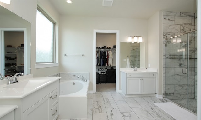 bathroom with double vanity, tile patterned flooring, and independent shower and bath