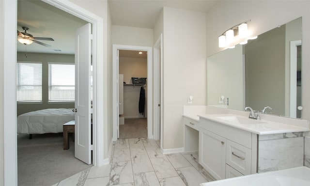 bathroom featuring ceiling fan, vanity, tile patterned floors, and a bathtub