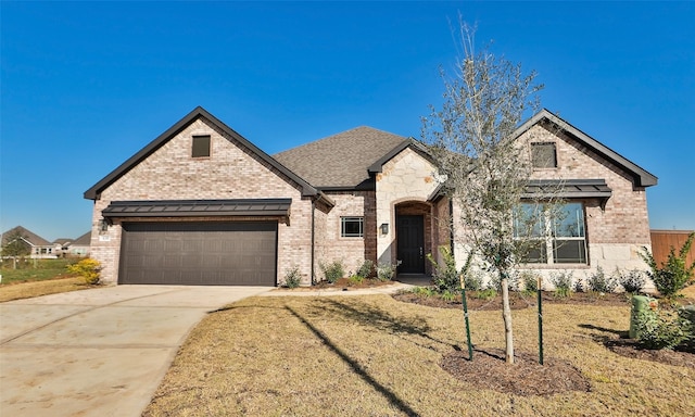 view of front of property with a garage