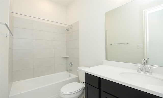 full bathroom featuring vanity, toilet, and tiled shower / bath