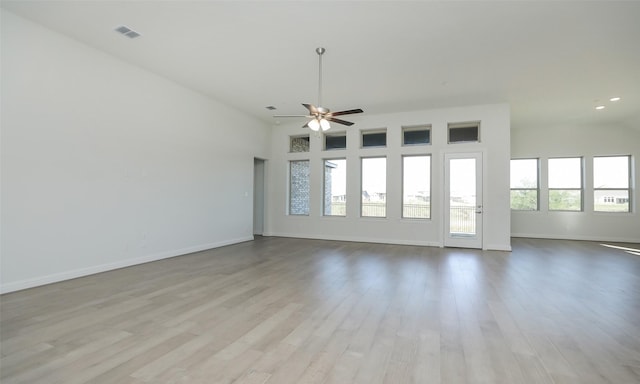 spare room featuring ceiling fan and light hardwood / wood-style floors