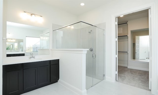 bathroom with vanity and an enclosed shower