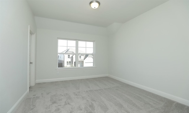 spare room with light colored carpet