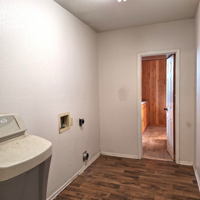 washroom featuring hookup for an electric dryer and dark wood-type flooring