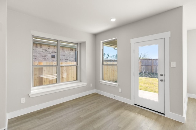 doorway with light hardwood / wood-style floors