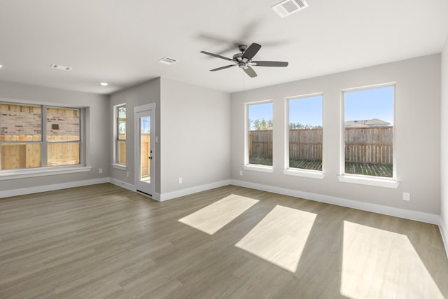 spare room featuring hardwood / wood-style floors and ceiling fan