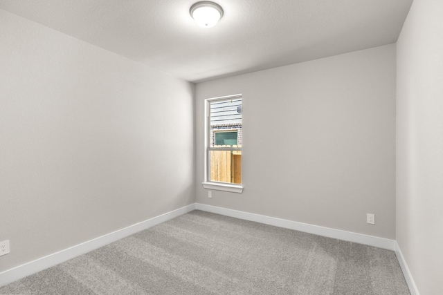 empty room featuring carpet floors