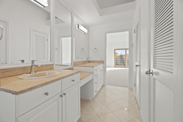 bathroom with vanity and tile patterned floors