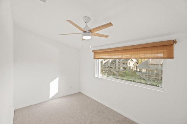 carpeted empty room with ceiling fan