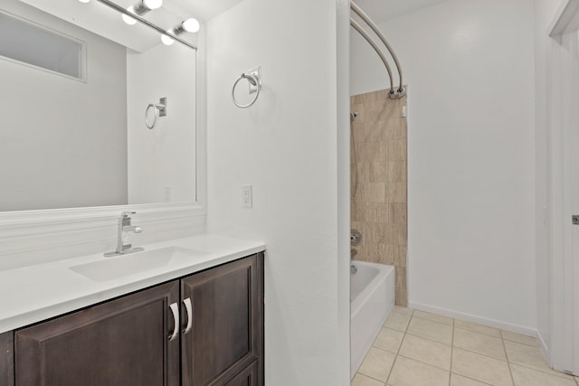 bathroom featuring vanity, tiled shower / bath combo, and tile patterned flooring