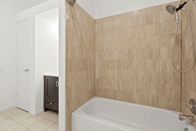 bathroom featuring vanity, tile patterned floors, and tiled shower / bath combo