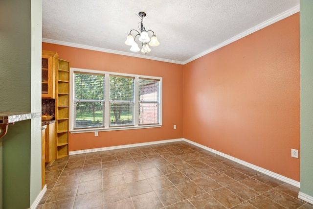 empty room featuring a textured ceiling, tile patterned floors, crown molding, and an inviting chandelier