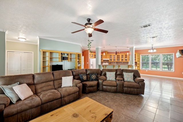 tiled living room featuring a textured ceiling, ornamental molding, and ceiling fan with notable chandelier