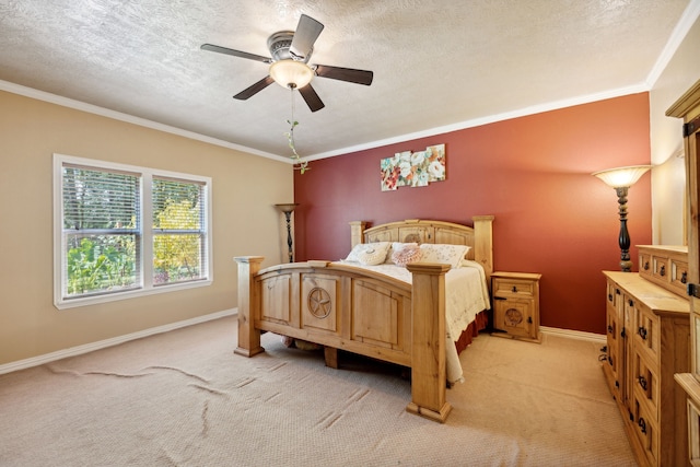 bedroom featuring ceiling fan, crown molding, a textured ceiling, and light colored carpet