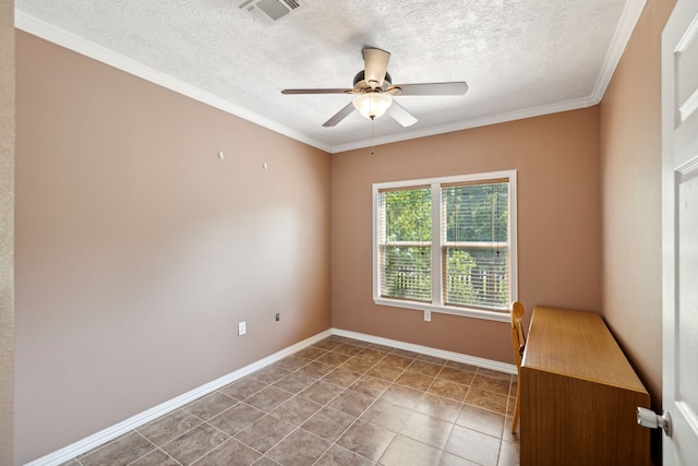 spare room featuring tile patterned floors, ceiling fan, a textured ceiling, and ornamental molding