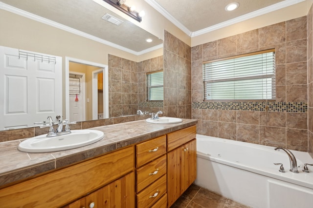 bathroom featuring tile patterned floors, a textured ceiling, double vanity, and a wealth of natural light