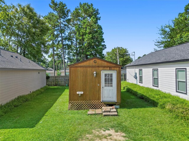 view of outbuilding featuring a yard