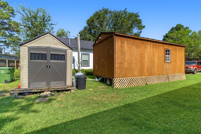 view of outbuilding featuring a yard