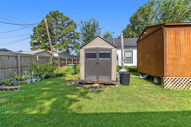 view of shed featuring fence