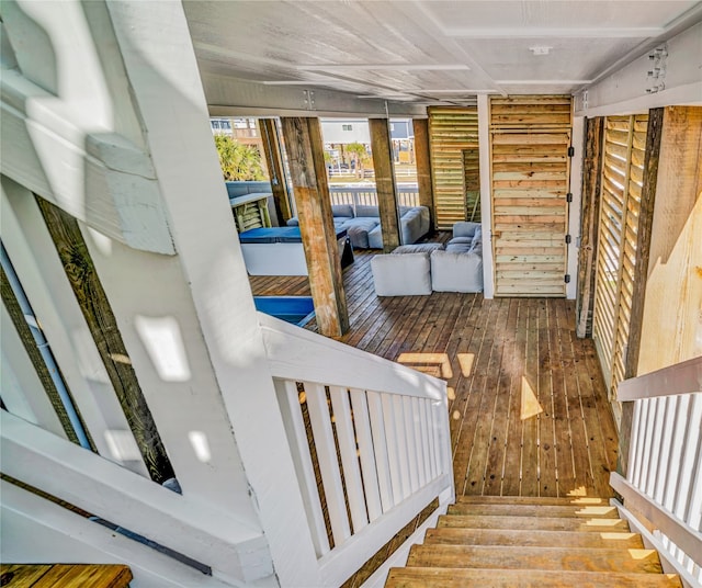 stairs with hardwood / wood-style flooring