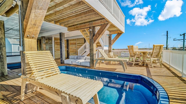 view of swimming pool with a wooden deck