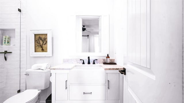 bathroom with ceiling fan, vanity, and toilet