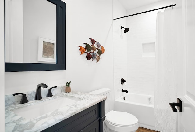 full bathroom featuring shower / bath combo, toilet, and vanity