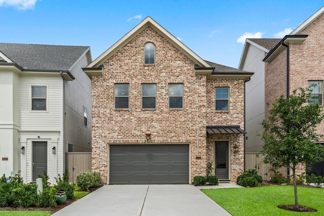 view of front property featuring a front yard and a garage