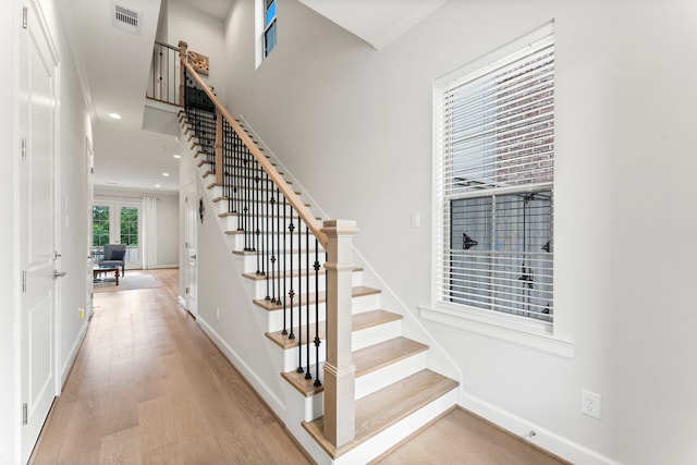 staircase featuring hardwood / wood-style floors