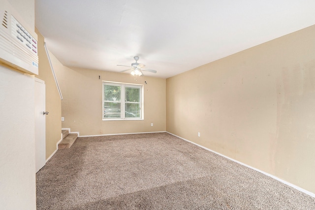 empty room featuring ceiling fan and carpet flooring