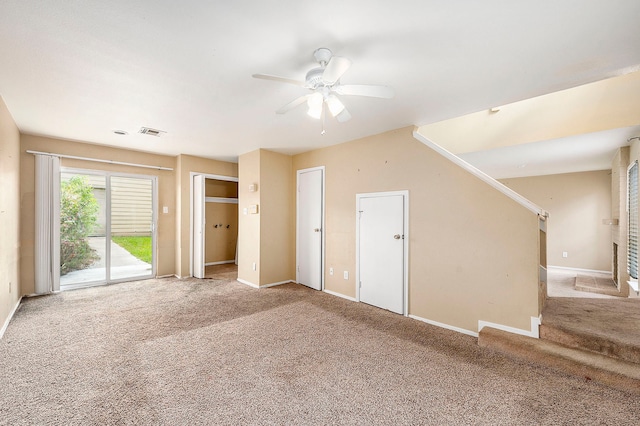 unfurnished living room with light carpet and ceiling fan