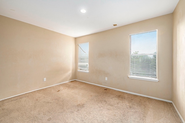 unfurnished room featuring carpet floors