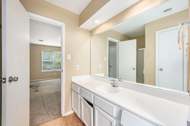 bathroom featuring wood-type flooring and vanity