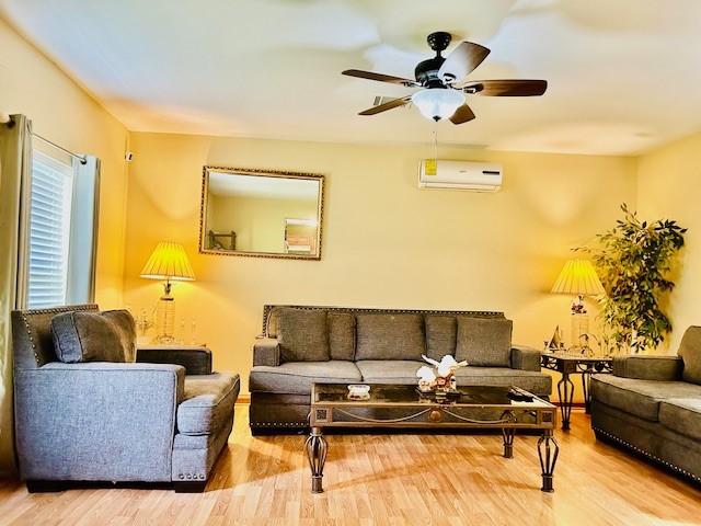 30470 Reids Prairie Rd, Waller, TX 77484 - living area featuring an AC wall unit, ceiling fan, and wood finished floors