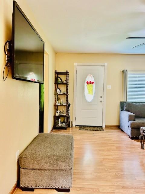 30470 Reids Prairie Rd, Waller, TX 77484 - entryway featuring light wood-style flooring, baseboards, and ceiling fan