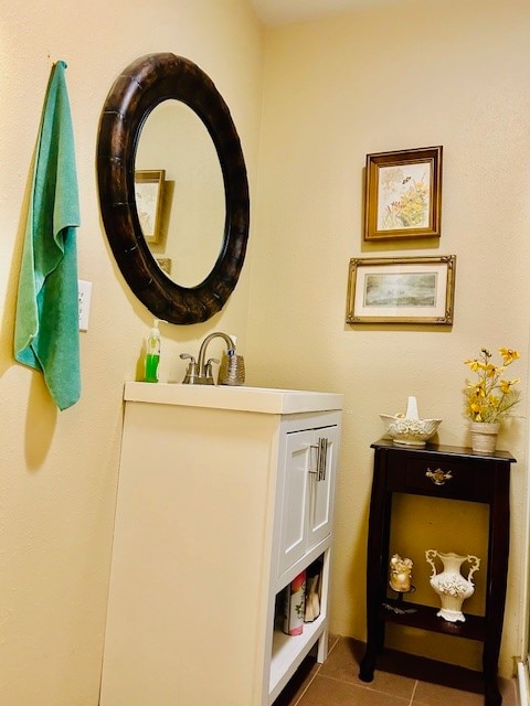 bathroom with tile patterned flooring and vanity