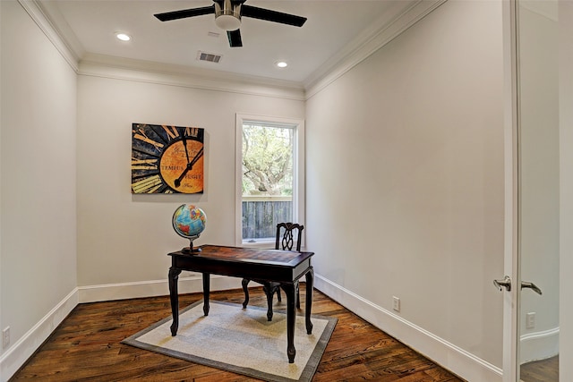 office space featuring ceiling fan, dark wood-type flooring, and ornamental molding