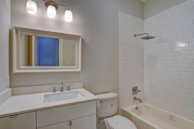 full bathroom with tiled shower / bath combo, vanity, and toilet