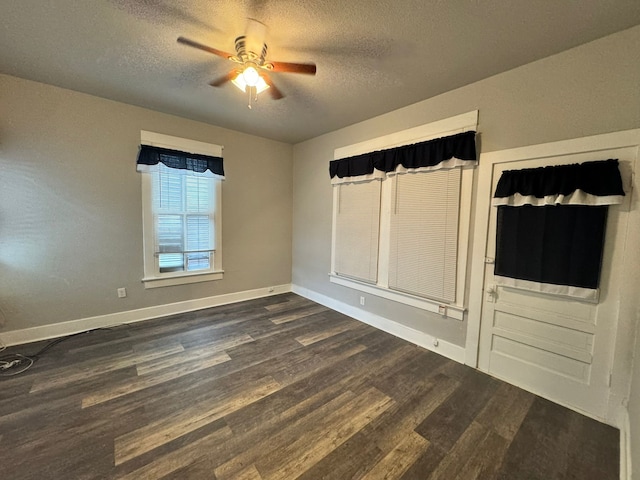 unfurnished bedroom with ceiling fan, dark wood-type flooring, and a textured ceiling