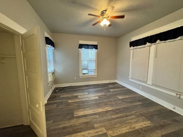 unfurnished bedroom with ceiling fan, a textured ceiling, and wood-type flooring