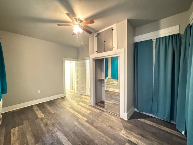 unfurnished bedroom featuring a closet, ceiling fan, and wood-type flooring