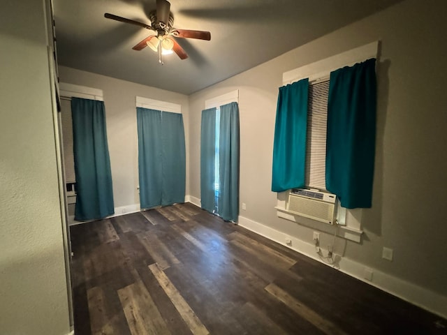 empty room featuring hardwood / wood-style flooring, cooling unit, and ceiling fan