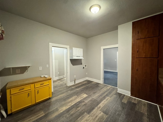 kitchen featuring a textured ceiling and dark hardwood / wood-style flooring