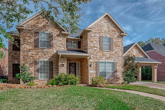 view of front of home featuring stone siding and a front yard