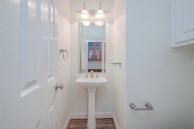 bathroom featuring wood-type flooring