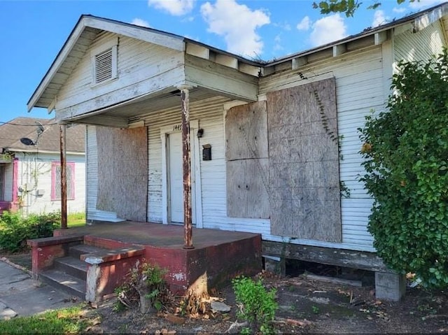 1447 Interstate 10 E, Beaumont, TX 77701 - back of property featuring a porch