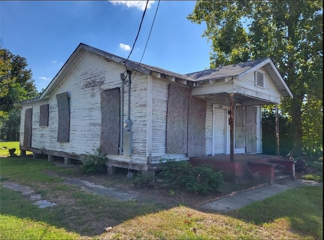 view of home's exterior with a yard