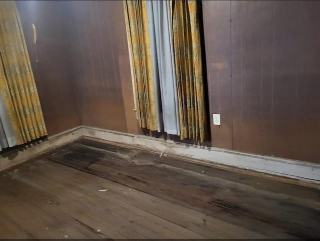 1447 Interstate 10 E, Beaumont, TX 77701 - spare room featuring wood finished floors