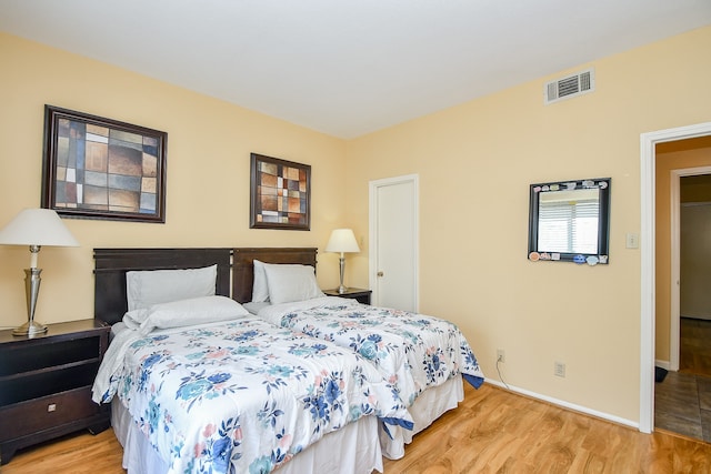 bedroom featuring light wood-type flooring